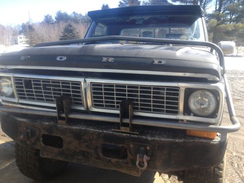1970 Ford F-250 - This Ford F-250 features a prominent grille and a heavy-duty bumper with a brush guard.