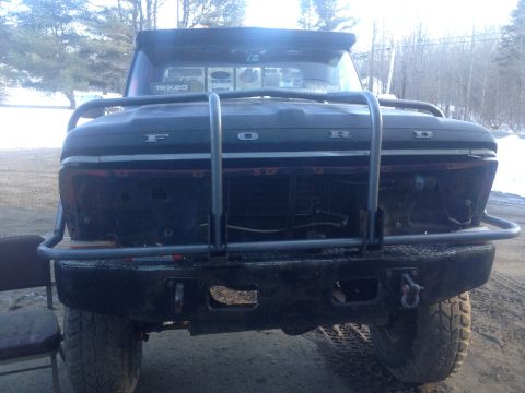 1970 Ford F-250 - Frontal view of a black 1970 Ford F-250 pickup truck equipped with a brush guard.