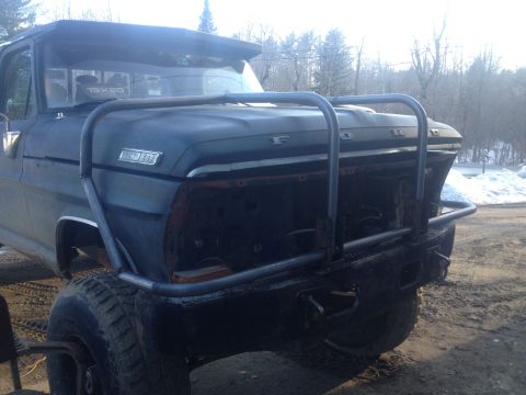 1970 Ford F-250 - This 1970 Ford F-250 is shown with a custom brush guard and its grille removed, highlighting its front-end modifications.
