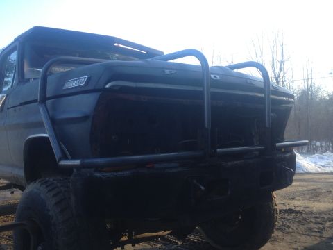 1970 Ford F-250 - Rear view of a 1970 Ford F-250 truck modified with a heavy-duty bumper and roll cage.