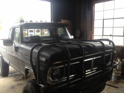 1970 Ford F-250 - Front view of a 1970 Ford F-250 pickup truck modified with a bull bar and roof lights.