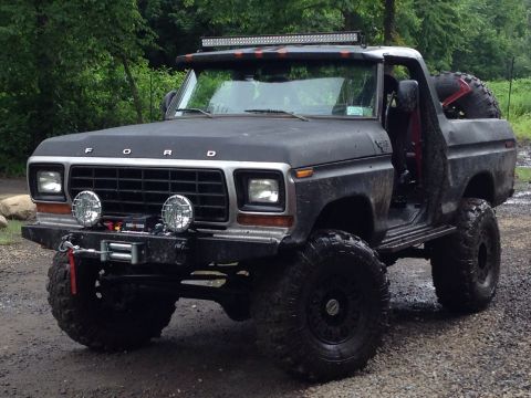 1979 Ford Bronco - This modified Ford Bronco features large off-road tires and a winch on the front bumper.
