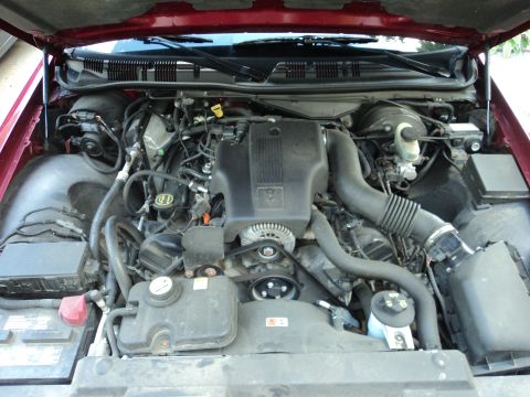 2004 Mercury Grand Marquis - Engine compartment of a 2004 Mercury Grand Marquis, showing the V8 engine and associated components.