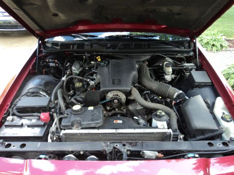 2004 Mercury Grand Marquis - Engine bay of a 2004 Mercury Grand Marquis, showing the V8 engine and associated components.