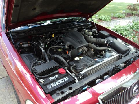 2004 Mercury Grand Marquis - Engine bay of a 2004 Mercury Grand Marquis, viewed from the front passenger side.