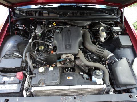 2004 Mercury Grand Marquis - The engine bay of a 2004 Mercury Grand Marquis is visible, with the hood open.