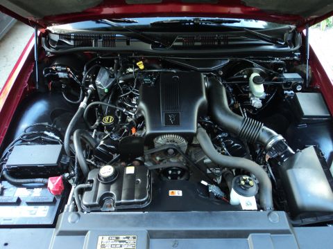2004 Mercury Grand Marquis - The engine bay of a 2004 Mercury Grand Marquis is shown with the hood open.