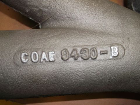 1963 Ford Galaxie - Close-up of a cast iron engine part showing the casting numbers COAE 9430-B.