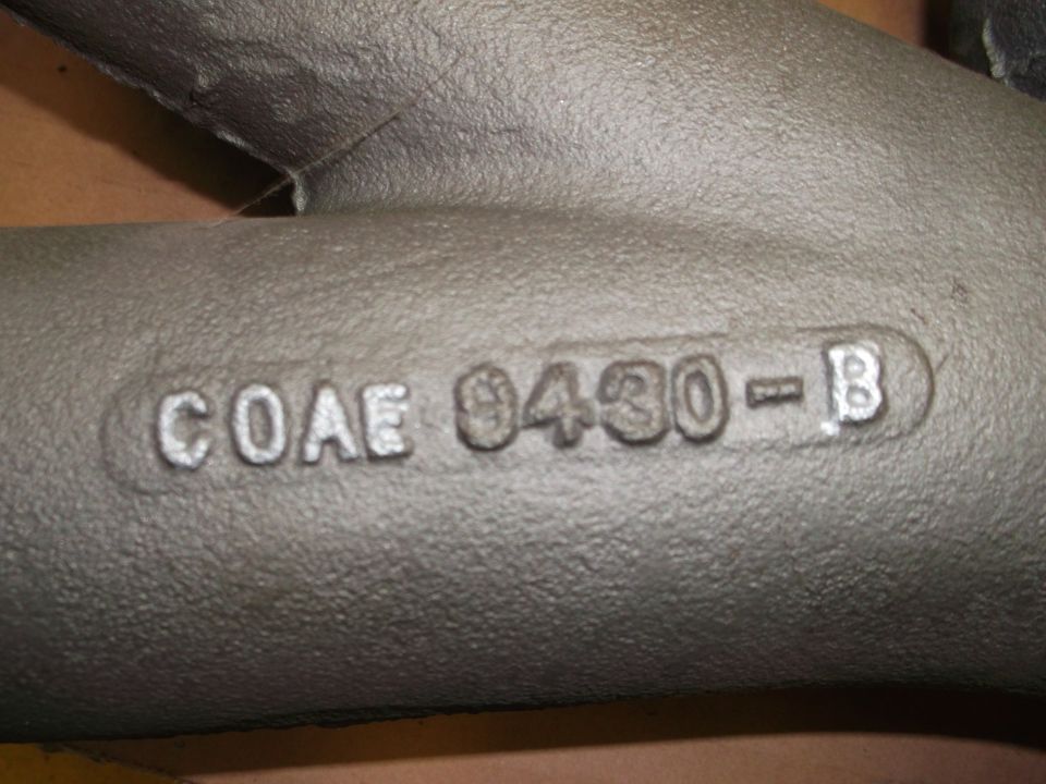 Cast iron engine part with casting numbers COAE 9430-B