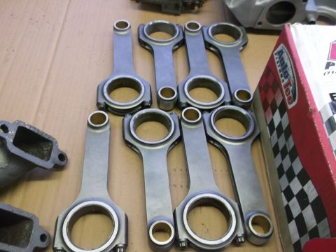 1963 Ford Galaxie - Engine connecting rods and related parts are laid out on a surface, with a branded box visible.