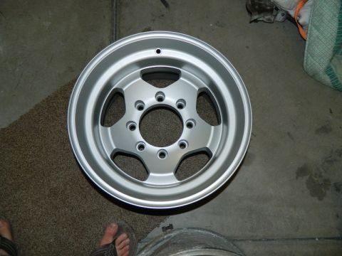 1979 Ford Bronco - A single silver aluminum wheel is shown, likely a replacement part.