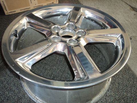 2004 Mercury Grand Marquis - A single chrome wheel is shown, with some wear visible on its surface.