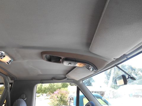 1994 Ford Bronco - Interior view of a 1994 Ford Bronco, focusing on the overhead console and dome light assembly.