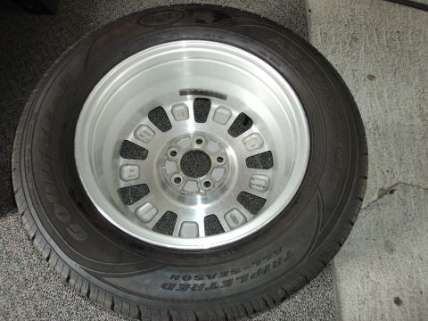 2004 Mercury Grand Marquis - A single wheel and tire assembly is shown, likely a spare or replacement part.