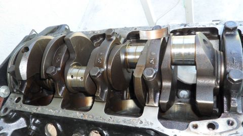 1972 Ford Ranchero - Close-up view of an engine's crankshaft and connecting rods, highlighting mechanical components.