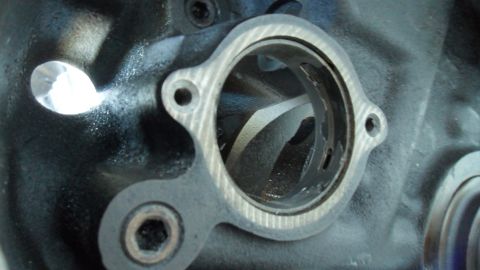 1972 Ford Ranchero - Close-up of an engine cylinder head port, showing internal machining and a gasket surface.