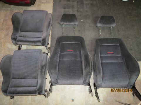 1985 Volkswagen GTI - Set of four gray Recaro car seats, likely for a performance hatchback.