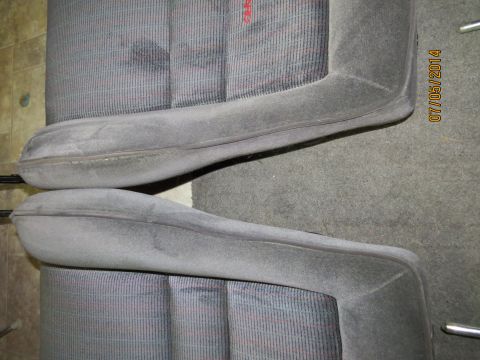 1985 Volkswagen GTI - Close-up of two car seats, showing the fabric pattern and bolster shape. A date stamp is visible on the right side of the image.