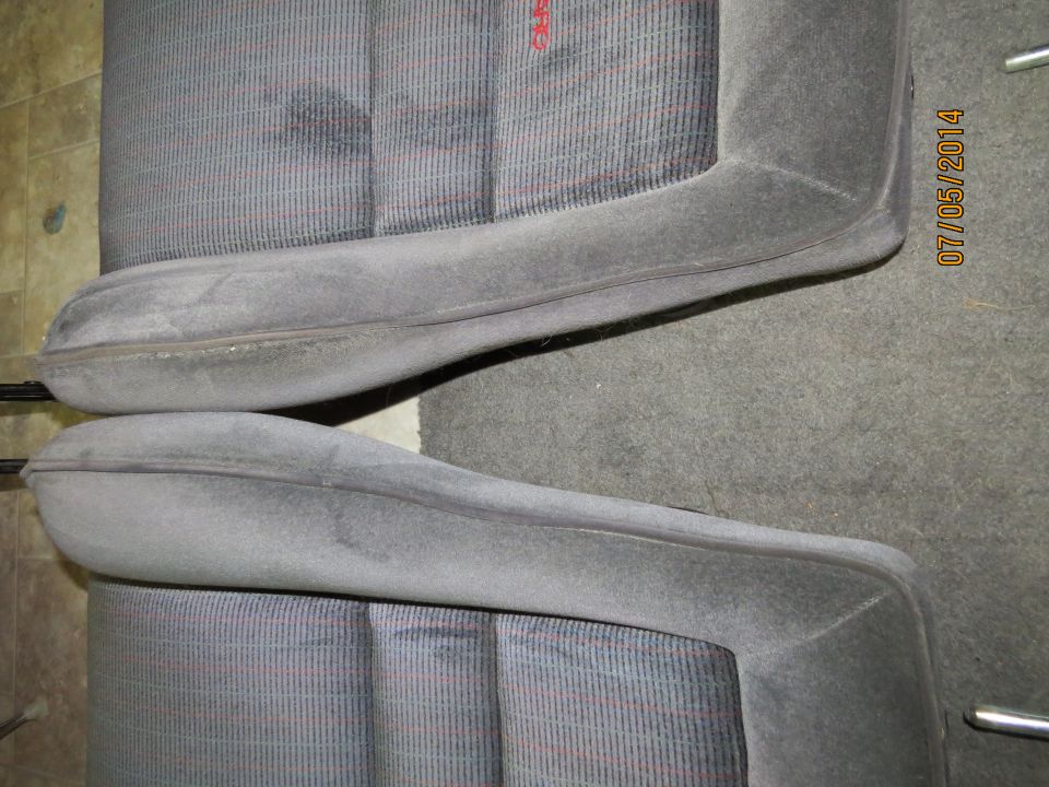Two car seats with striped fabric and gray bolsters. Date stamp on right reads 07/05/2014