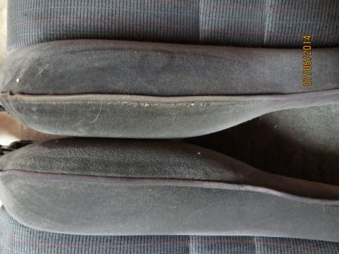 1985 Volkswagen GTI - Close-up of car seat bolsters and fabric, with a date stamp visible on the right side.