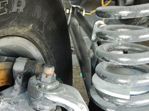 1979 Ford Bronco - This image shows suspension parts and a tire, not enough detail to confirm the vehicle model or year.