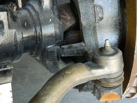 1979 Ford Bronco - Close-up view of a vehicle's front axle and steering linkage, with a watermark for Supermotors.net visible.