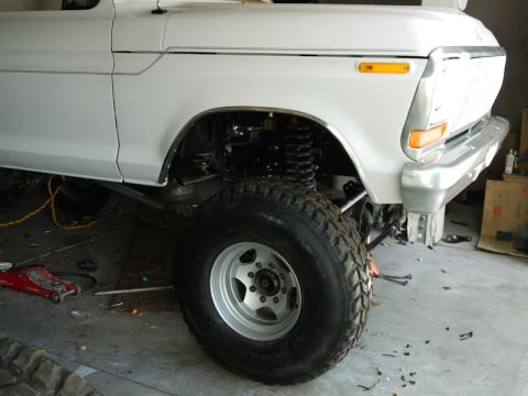 1979 Ford Bronco - This vehicle appears to be a pickup truck, not a Bronco, with modifications to its suspension and tires.