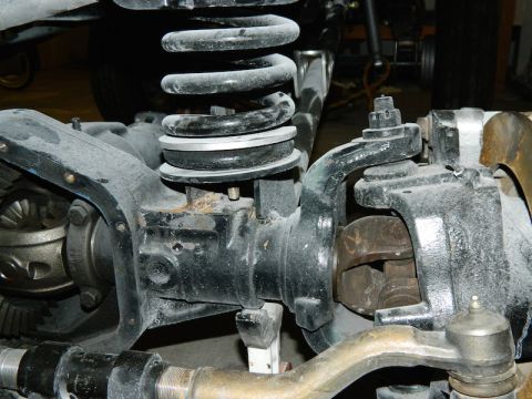 1979 Ford Bronco - Front axle and suspension parts are visible in this close-up image.
