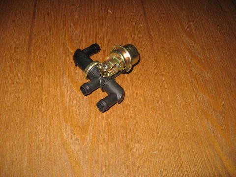 1994 Ford Bronco - Heater control valve shown on a wooden surface.
