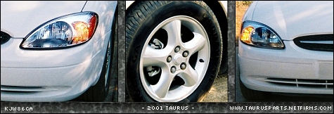 2000 Ford Taurus - Close-up of a white 2001 Ford Taurus, its headlight and wheel.