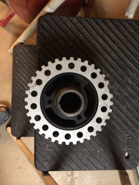 1996 Ford Bronco - Crankshaft pulley shown on a textured surface.