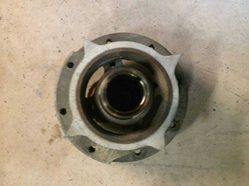 Supercharger pulley hub with six bolt holes and a central opening