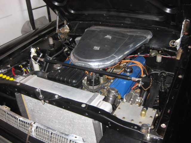 1967 Ford Fairlane engine bay with V8 engine, aftermarket air cleaner, and radiator