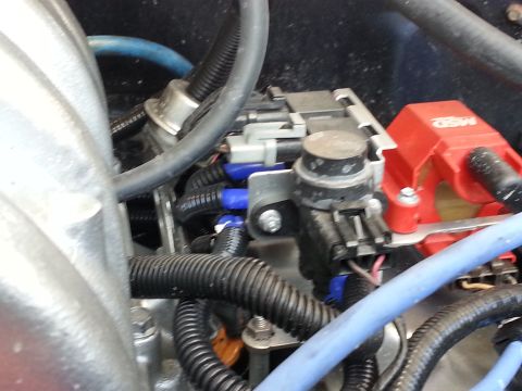 1994 Ford Bronco - Close-up of engine bay showing electrical components and wiring, including a red MSD ignition coil.