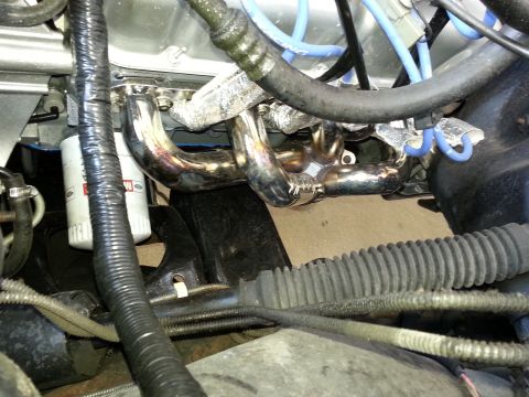 1994 Ford Bronco - Shiny exhaust headers and an oil filter are visible in this engine compartment.