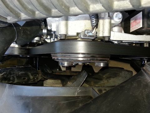1994 Ford Bronco - The serpentine belt and fan are visible in this engine bay close-up.