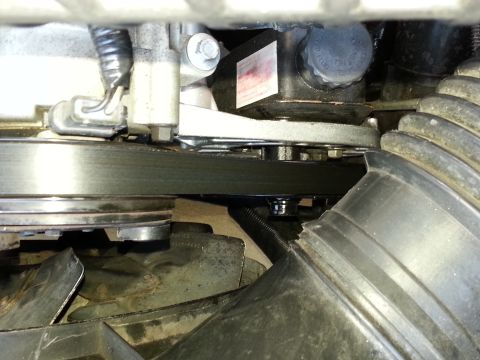 1994 Ford Bronco - Close-up view of engine components, including the drive belt and pulleys.