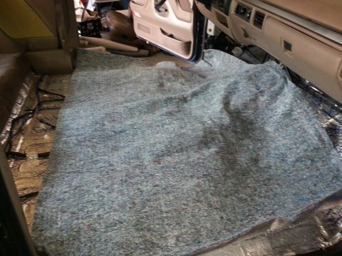1994 Ford Bronco - Installing new carpet in a 1994 Ford Bronco, showing the interior floor with sound deadening installed.