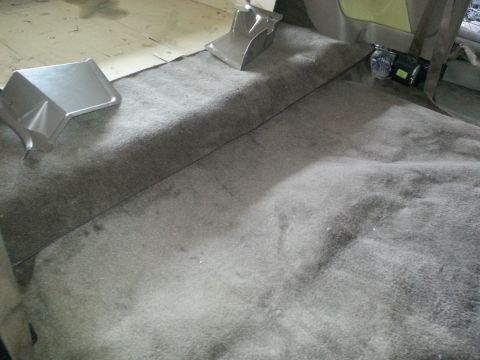 1994 Ford Bronco - The interior carpet and seatbelt are visible in this vehicle.
