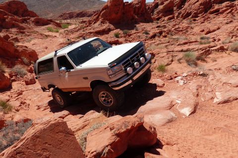 1995 Ford Bronco - This Ford Bronco navigates a rocky trail in a desert environment.