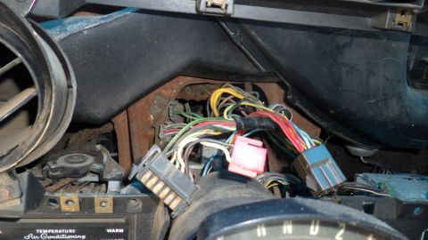 1972 Ford Ranchero - A close-up view of a vehicle's interior wiring harness, showing a complex network of wires and connectors.