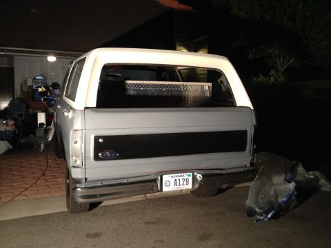 1982 Ford Bronco - This 1982 Ford Bronco is seen from the rear, a gray body and white removable top.