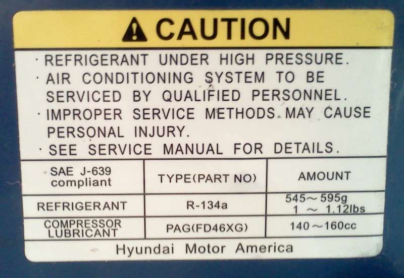 Caution label for refrigerant and compressor lubricant with Hyundai Motor America text