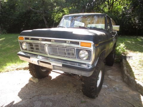 1978 Ford Bronco - Front view of a 1978 Ford Bronco with a lifted suspension and black paint.