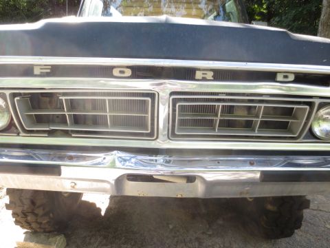 1978 Ford Bronco - The front grille and chrome bumper of a 1978 Ford Bronco, ready for paint.