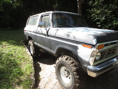 1978 Ford Bronco - This 1978 Ford Bronco is shown in a three-quarter front view, sitting on a dirt and grass area.