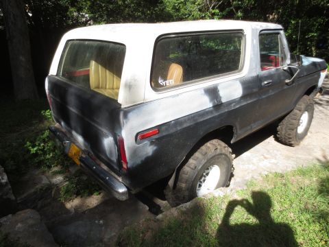1978 Ford Bronco - This 1978 Ford Bronco is shown in a three-quarter front view, with its white hardtop contrasting with the black primer body.