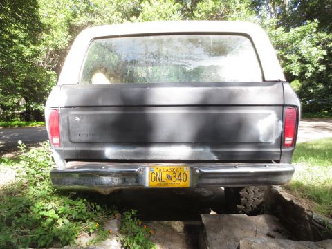 1978 Ford Bronco - Rear view of a 1978 Ford Bronco, showing its tailgate and bumper.