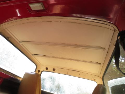 1978 Ford Bronco - Interior shot of a vehicle's headliner and window frame, possibly undergoing restoration.