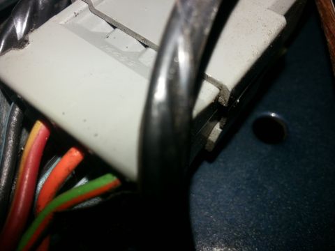 1994 Ford Bronco - A gray electrical connector with multiple colored wires is visible in this close-up view.
